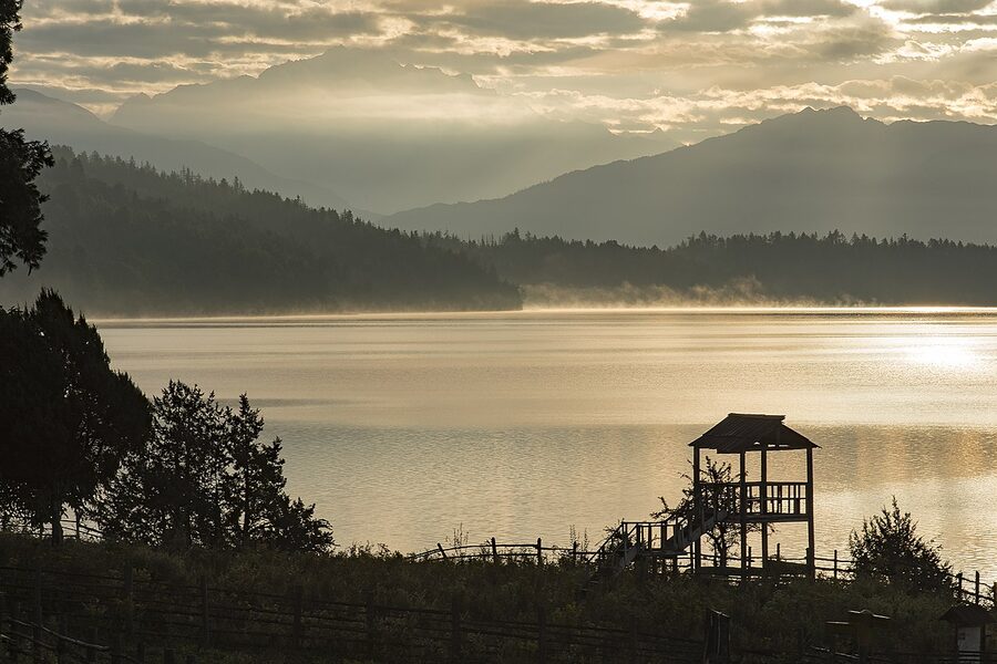 Rara Lake at sunrise reflecting mountains
