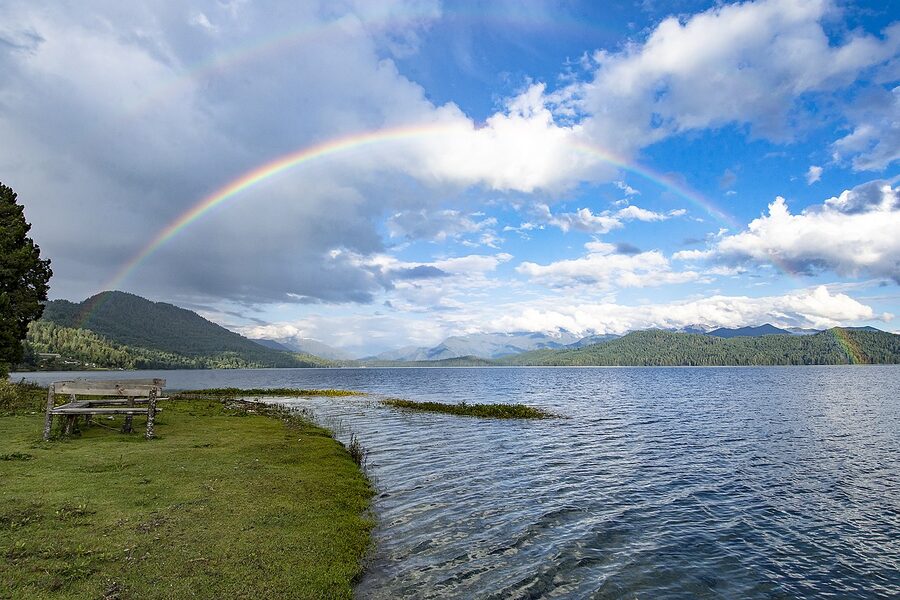 Rainbow arching over Rara Lake