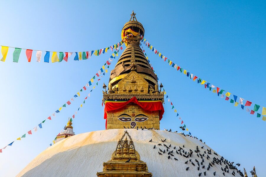 Swayambhunath stupa with painted eyes on a hilltop in Kathmandu